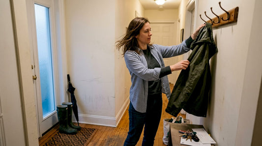 Woman arriving home with adaptive wardrobe layers